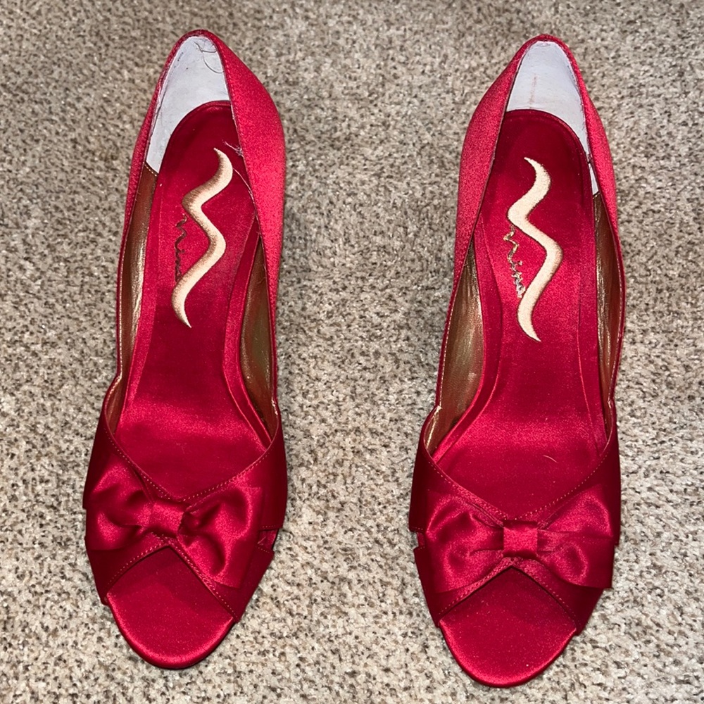 Brand NEW red heels. Made by Nina.